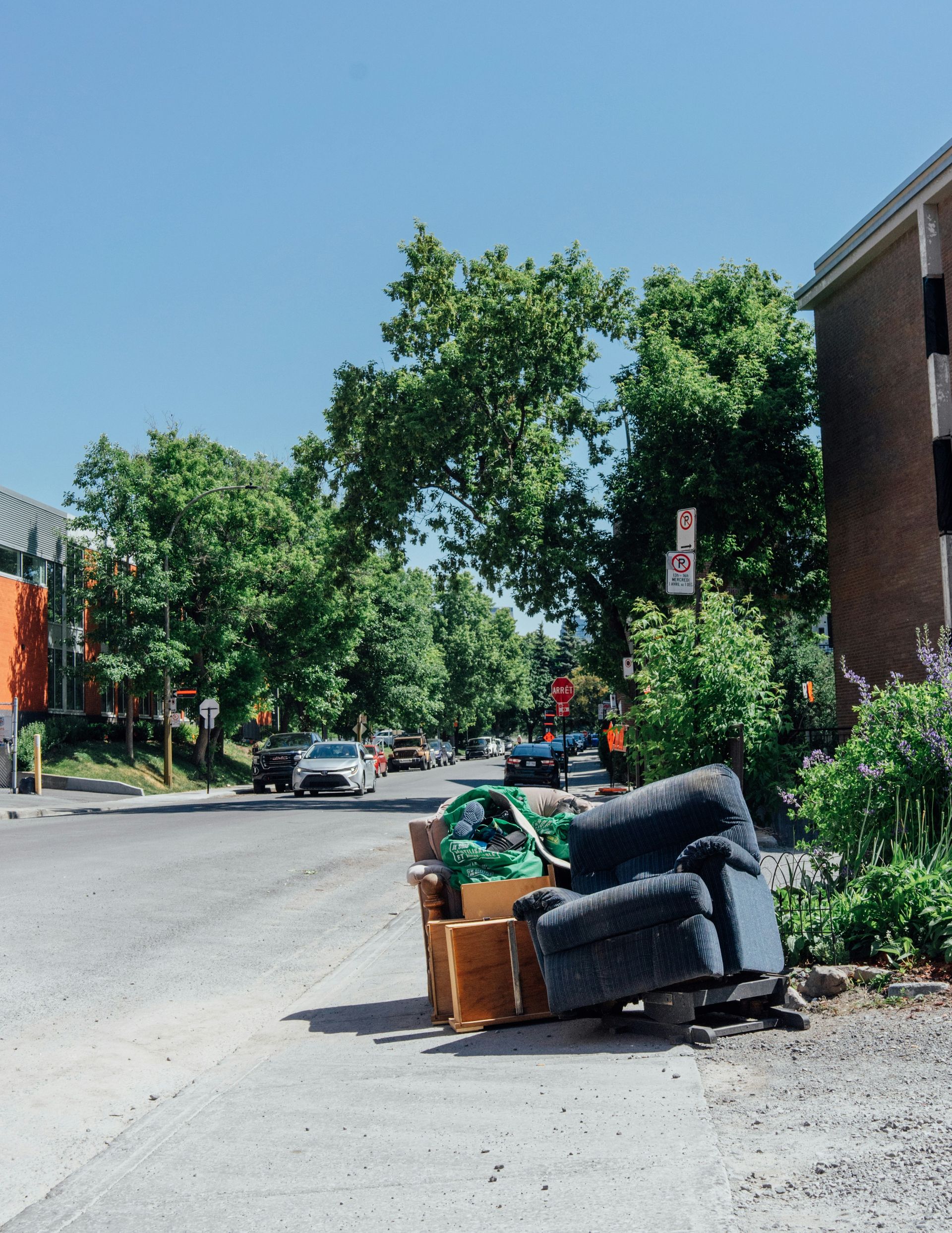 A pile of furniture sitting on the side of a road